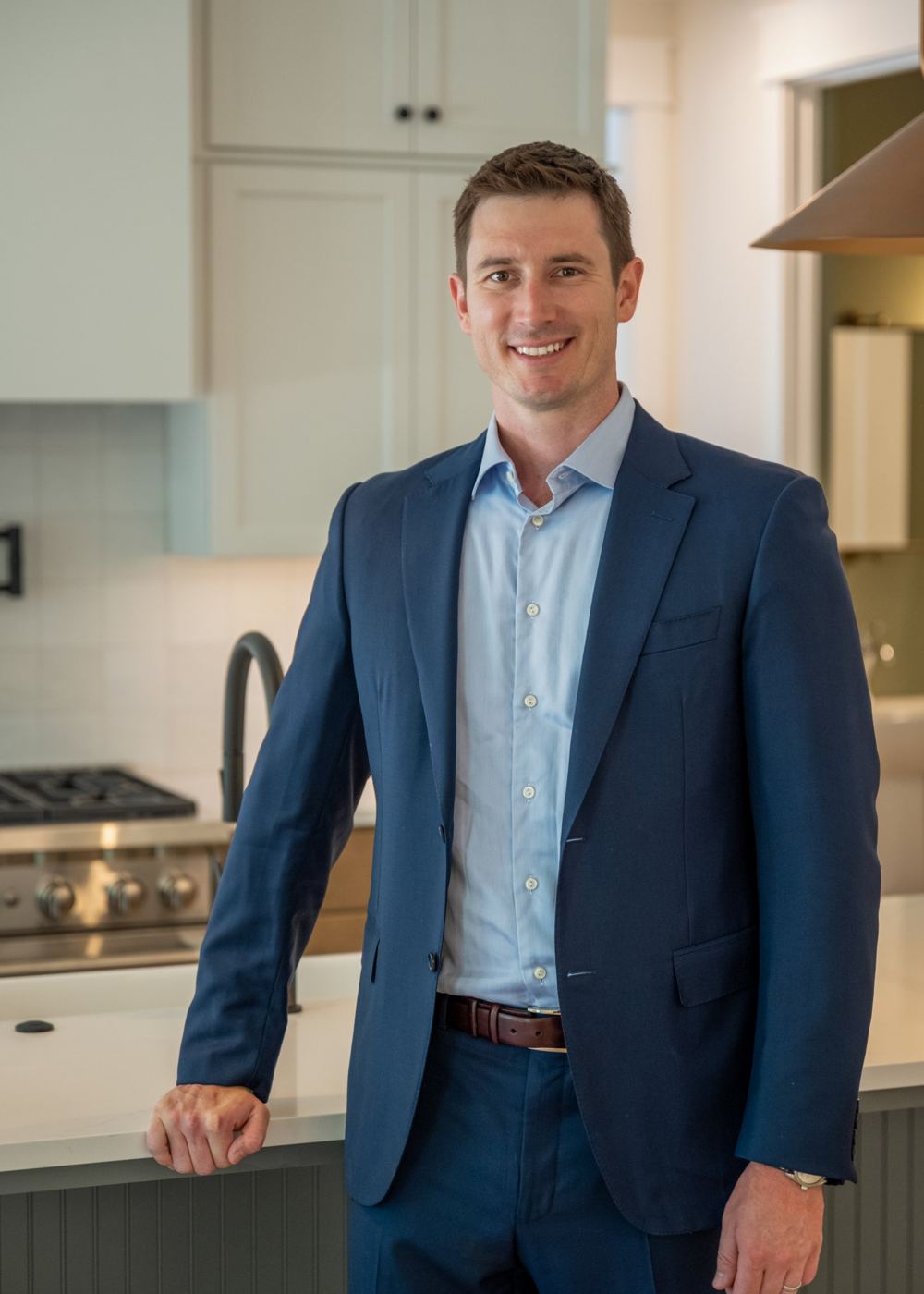 Adam Tuck in the kitchen of a home he built